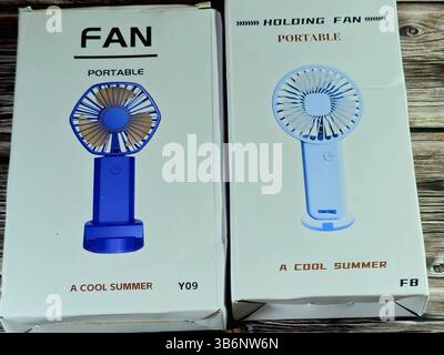 Cairo, Egypt, June 30 2024: portable holding fan, Mini Portable USB Hand Fan, USB Fan high speed, mini USB desktop and Handheld Fan, rechargeable fans Stock Photo