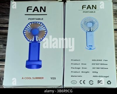 Cairo, Egypt, June 30 2024: portable holding fan, Mini Portable USB Hand Fan, USB Fan high speed, mini USB desktop and Handheld Fan, rechargeable fans Stock Photo
