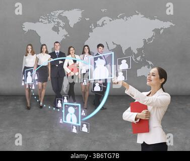 Interface business office of the future, a woman in office with map on background pushing on virtual buttons Stock Photo