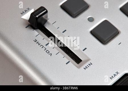 Midi keyboard controller close up with faders wheel buttons and knobs pitch, band, modulation, octave max min Stock Photo