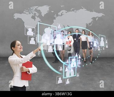 Interface business office of the future, a woman in office with map on background pushing on virtual buttons Stock Photo