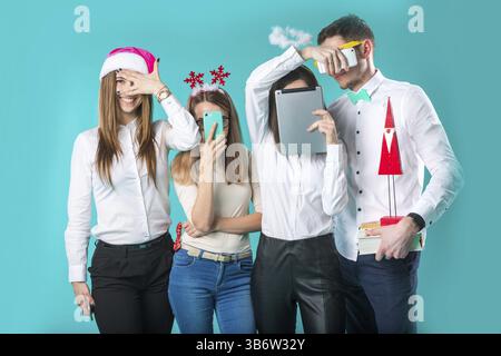 Business people celebrating New Year party and Christmas celebration. Office Christmas Party. Group Colleagues Having Fun New Year Celebration. Co wor Stock Photo