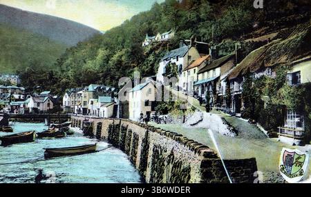 Mar’s Hill, Lynmouth, Devon. A harbour area with small boats on the water with numerous buildings and a steep cliff overlooking it. Published by Woolstone Brothers of London as part of their Glazette Series, around 1907. From a selection of miscellaneous postcards from the early 20th Century. Stock Photo
