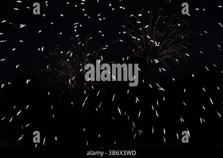 Fireworks festival on dark sky . countless small colored bright lights on a black background Stock Photo