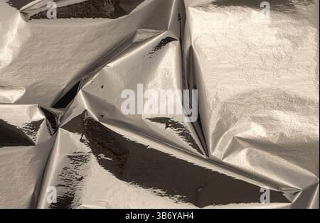 High contrast silver foil texture with dramatic highlights and heavy ...