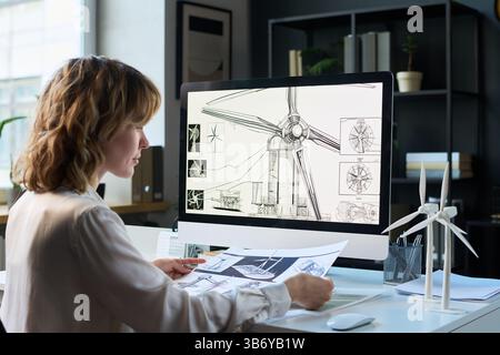 Female Industrial Engineer Working on New Wind Turbine Stock Photo