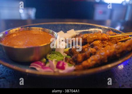 Malaysian style chicken satay with it's condiments Stock Photo - Alamy