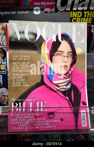 Billie Eilish portrait on the front cover of British Vogue magazine on a supermarket magazines shelf in April May 2025 London UK Great Britain Stock Photo