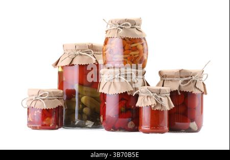 Many jars with different pickled products isolated on white Stock Photo