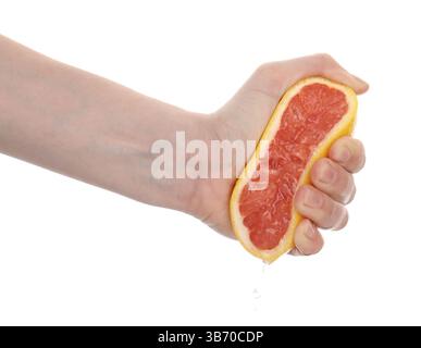 Woman squeezing grapefruit on white background, closeup Stock Photo