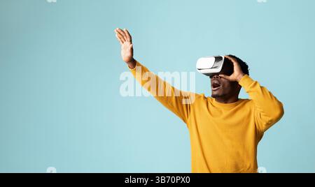 Young african american guy using VR glasses Stock Photo