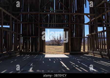 view out old broken down barn door from the interior Stock Photo