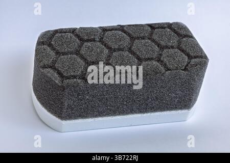 Car detailing applicator pad, black grey foam sponge with hexagon pattern Stock Photo