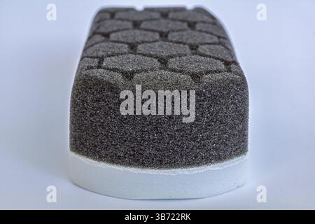 Car detailing applicator pad, black grey foam sponge with hexagon pattern Stock Photo