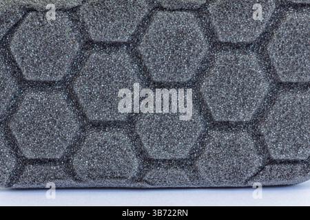 Car detailing applicator pad, black grey foam sponge with hexagon pattern Stock Photo