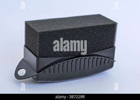 Black tire shine foam applicator for car detailing isolated on white background Stock Photo
