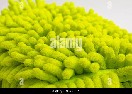 Close up of yellow microfiber car wash mitt with tendrils car wash detailing Stock Photo