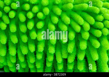 Close up of green microfiber car wash mitt with tendrils car wash detailing Stock Photo