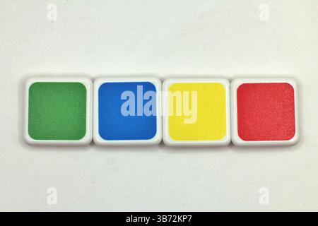 Close-up of colorful wooden toy blocks arranged in a playful stack. Stock Photo