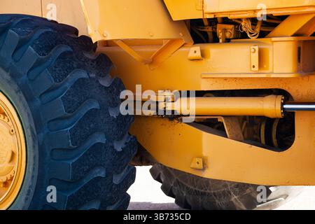 Frontal bulldozer loader. Yellow excavator close up. Stock Photo