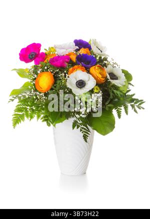A colorul spring bouquet with persian buttercups and poppy anemones in vase isolated on white background Stock Photo