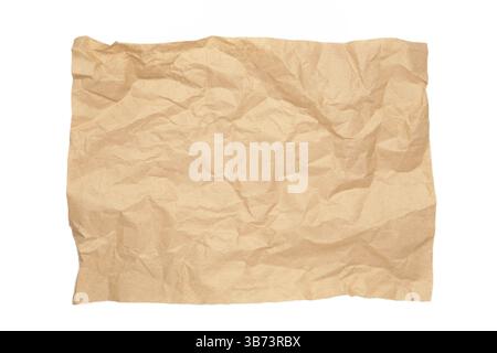 Crumpled piece of beige parchment or baking paper isolated on white background. Copy space for text and design element. Top view Stock Photo