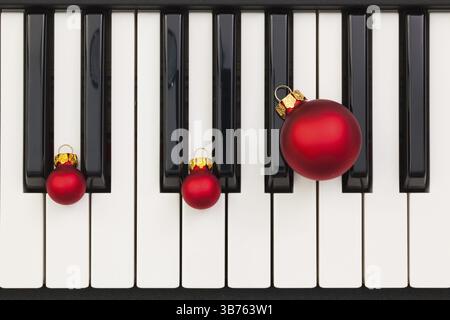 Top view close up shot of piano keyboard and Christmas decoration. Flat Lay Image Stock Photo