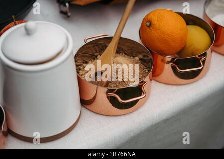 Fresh ingredients in copper pots ready for cooking. Stock Photo