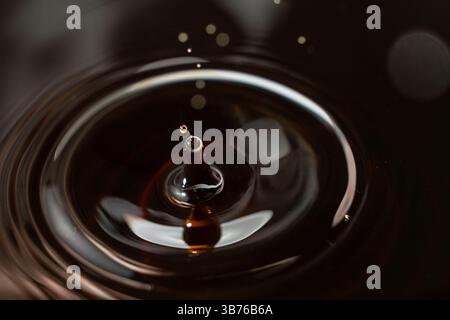 Black Brown Drop of Soy Sauce Close Focus. Stock Photo