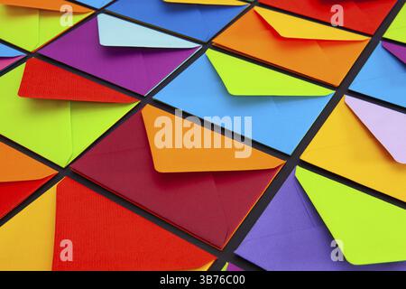 Composition with white and colored envelopes on the table. The photo suitable for various holidays and anniversaries Stock Photo