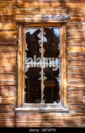 Exterior of an old broken wooden window in an old ghost town Stock Photo