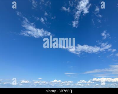 A stunning view of the sky filled with beautiful, fluffy clouds Stock Photo