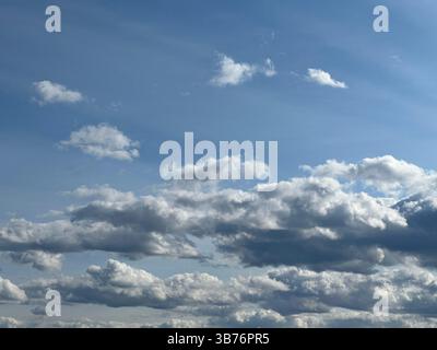 A stunning view of the sky filled with beautiful, fluffy clouds Stock Photo