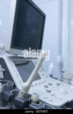 Ultrasound technology showcased with a probing sensor and display unit, critical in modern diagnostics within medical facilities for examining patient Stock Photo
