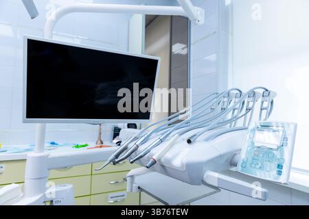 State-of-the-Art Dental Setup Featuring Advanced Technology and Equipment for Enhanced Patient Care and Comfort in a Modern Dental Clinic Setting Stock Photo