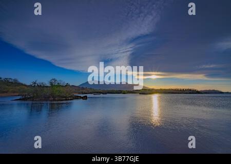 Sun Setting Next to the Mountains at Lough Leane Killarney National Park Ireland Stock Photo