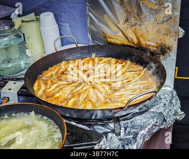 Fried smelt. Delicious small fish with fresh parsley in a white plate ...