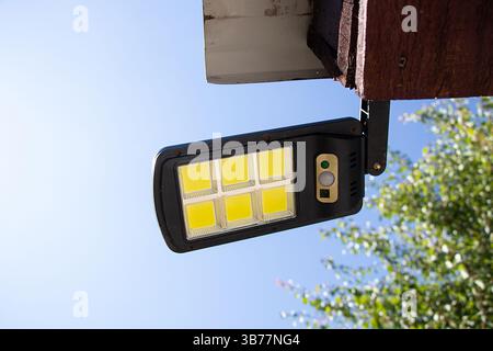 Outdoor LED lamp on the roof of the house, outdoor lighting in Ukraine Stock Photo