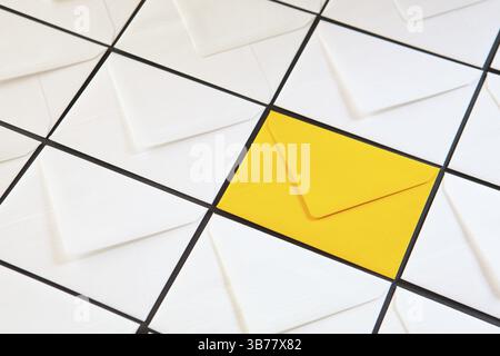 Composition with white and yellow, envelopes on the table. Different colored envelopes on the table Stock Photo