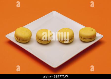 Traditional french colorful macarons on the white plate Stock Photo