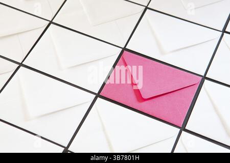 Composition with white and pink envelopes on the table. Different colored envelopes on the table Stock Photo