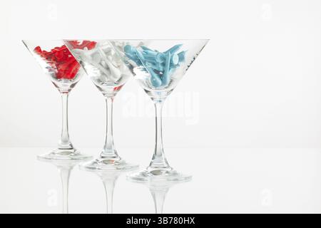 Three glasses of champagne and golf equipments on the glass table Stock Photo