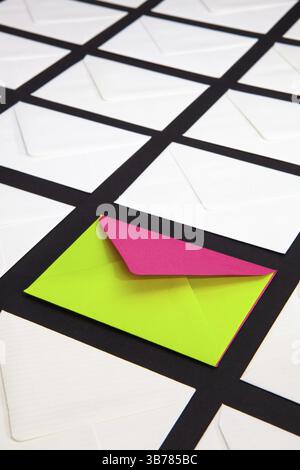 Composition with white and two-color envelopes on the table. The photo suitable for various holidays and anniversaries Stock Photo