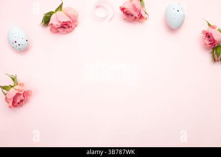 Easter frame, border. Eggs decorated with flowers top view empty copy space backgroud. Holiday backdrop. Flat lay objects, nobody. Stock Photo