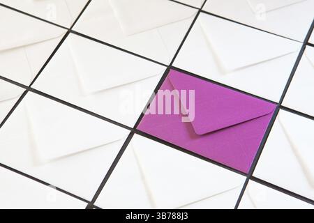 Composition with white and purple envelopes on the table. Different colored envelopes on the table Stock Photo