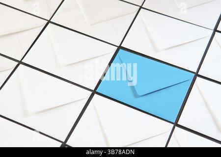 Composition with white and blue envelopes on the table. Different colored envelopes on the table Stock Photo