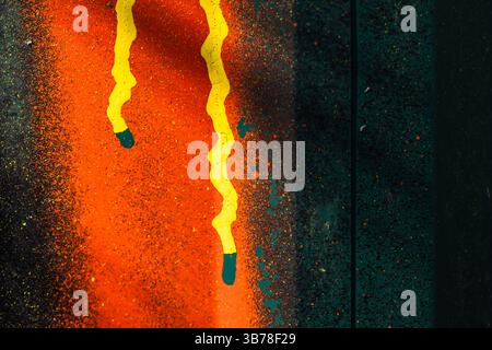 Vivid abstract artwork showcasing bright orange and yellow patterns against a dark textured backdrop, creating a striking visual effect. The interplay Stock Photo