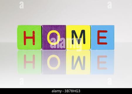 Home - an inscription from children's wooden blocks Stock Photo