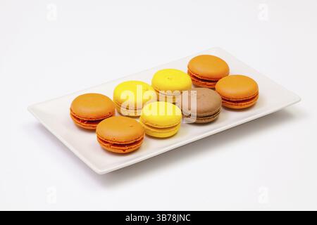 Traditional french colorful macarons on the white plate Stock Photo