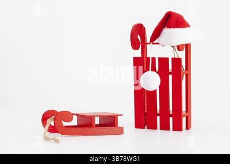 Santa Claus Red Wodden Sleigh with Santa Cap isolated on white background Stock Photo
